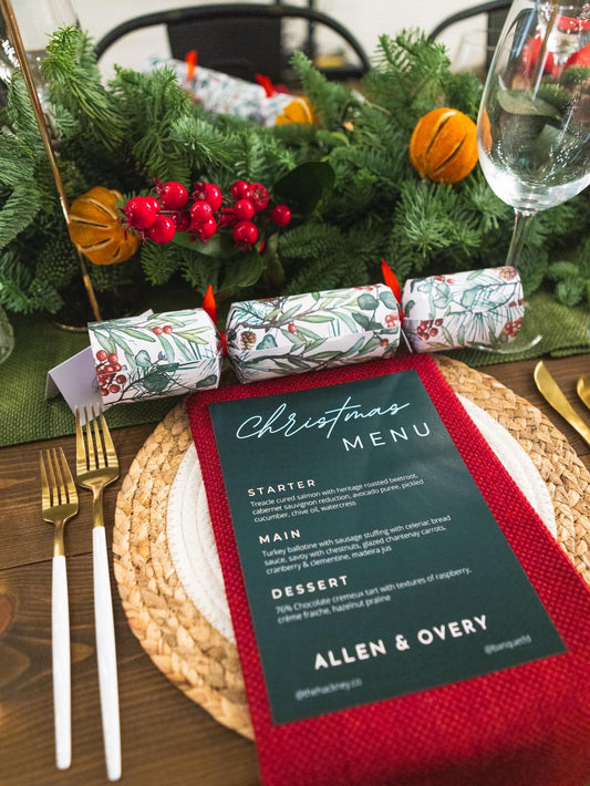 Guests enjoying a festive Christmas party with a variety of themed props, smiling in front of a holiday-themed photo booth setup, capturing fun memories in a lively and cheerful atmosphere.